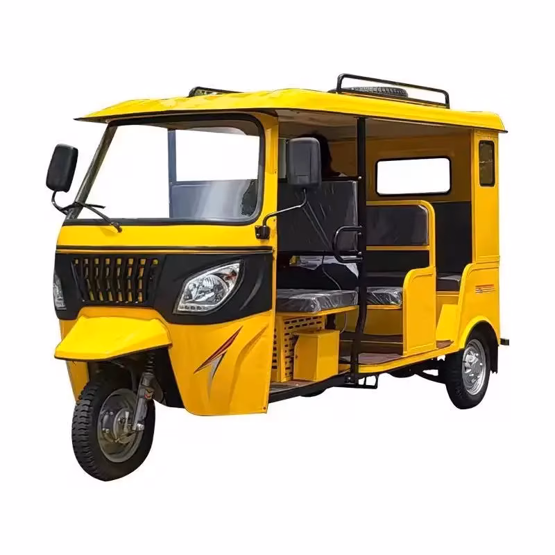 electric passenger tuk tuk - Bright yellow electric auto rickshaw with three wheels, covered open-side passenger cabin and fr