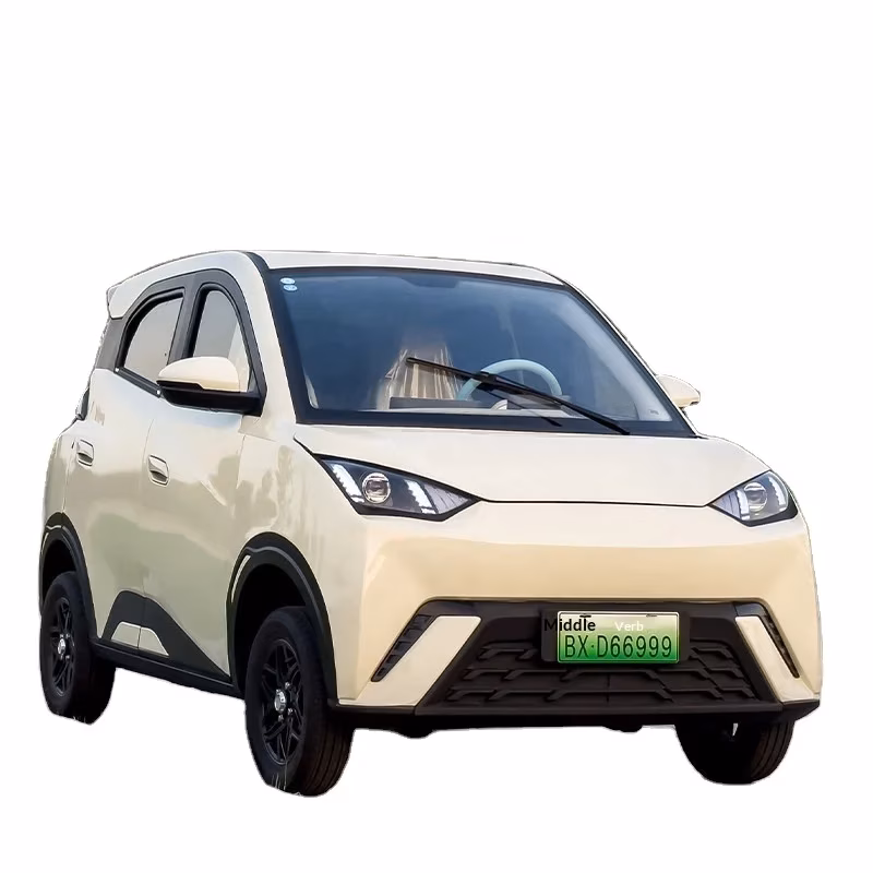 all weather electric - Cream metallic compact electric car with black cladding, LED headlights, and green license plate