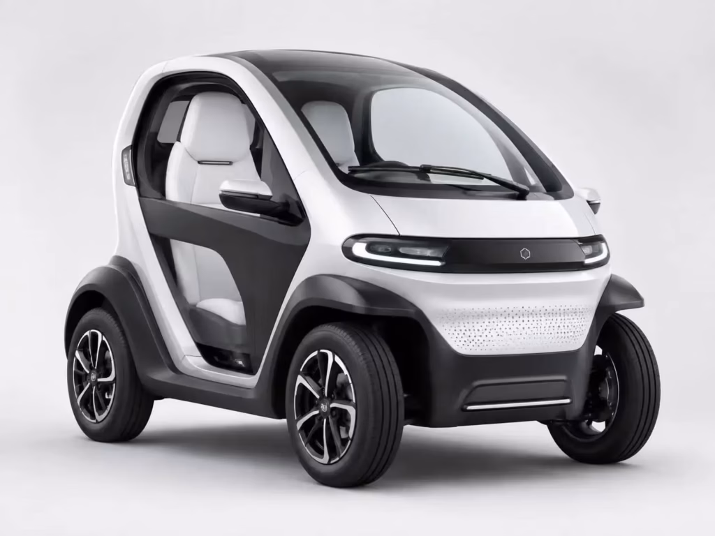electric mini ev car - Compact three-wheeled electric city car with panoramic glass roof, white and black two-tone body, and 
